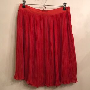 Orange pleated skirt